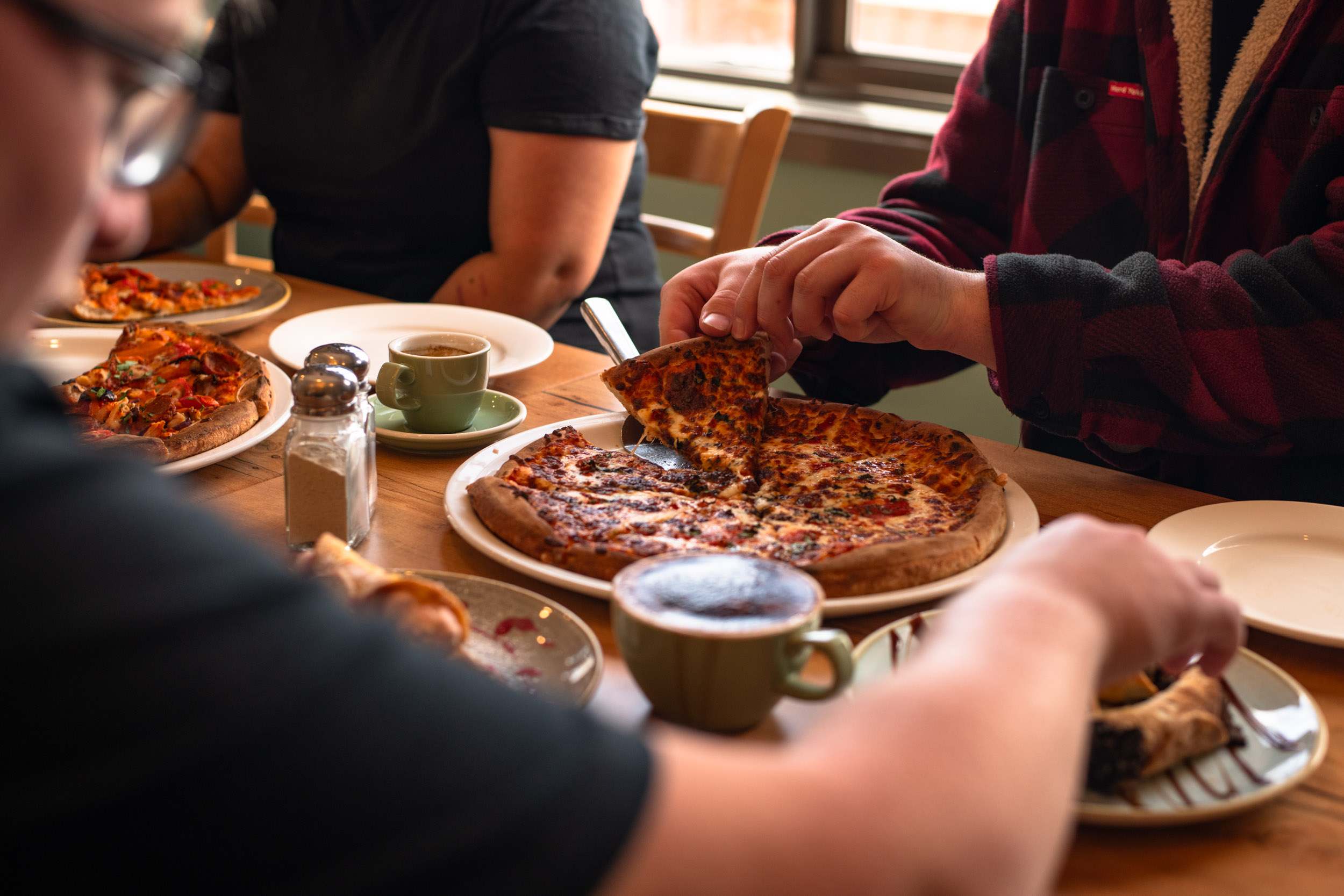 People eating pizza.